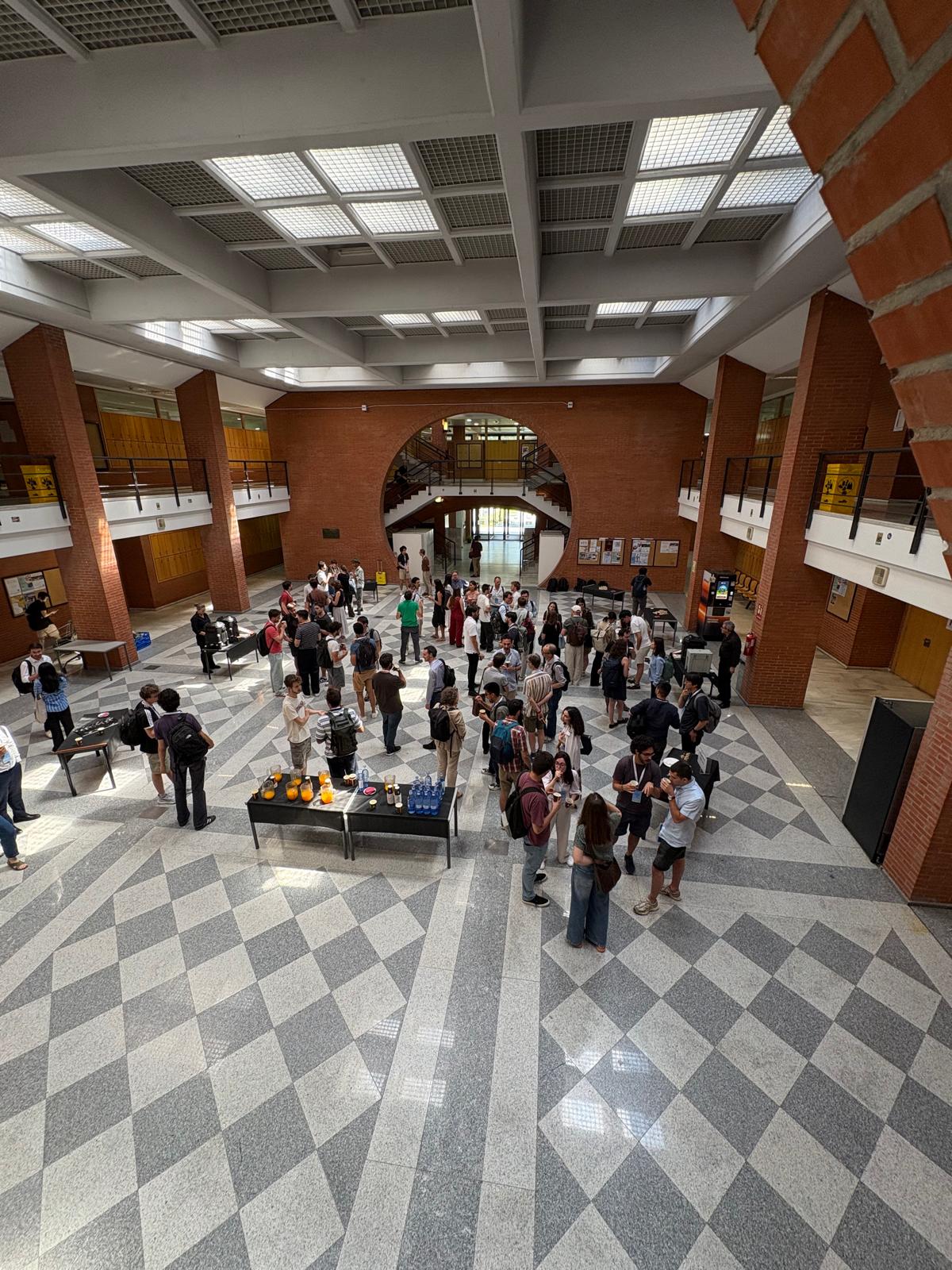 Attendees during the coffee break at the hall of building 14